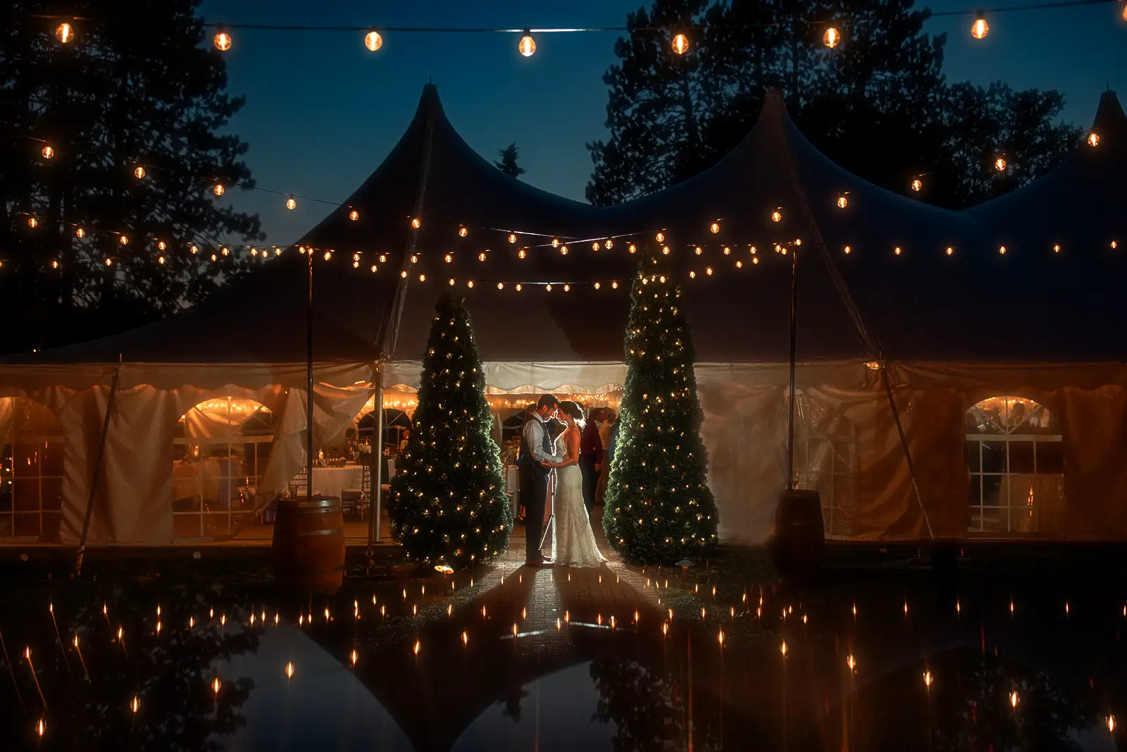 Couple at wedding lights all around