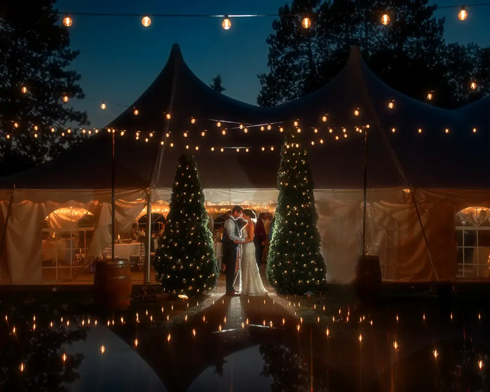 Couple at wedding lights all around