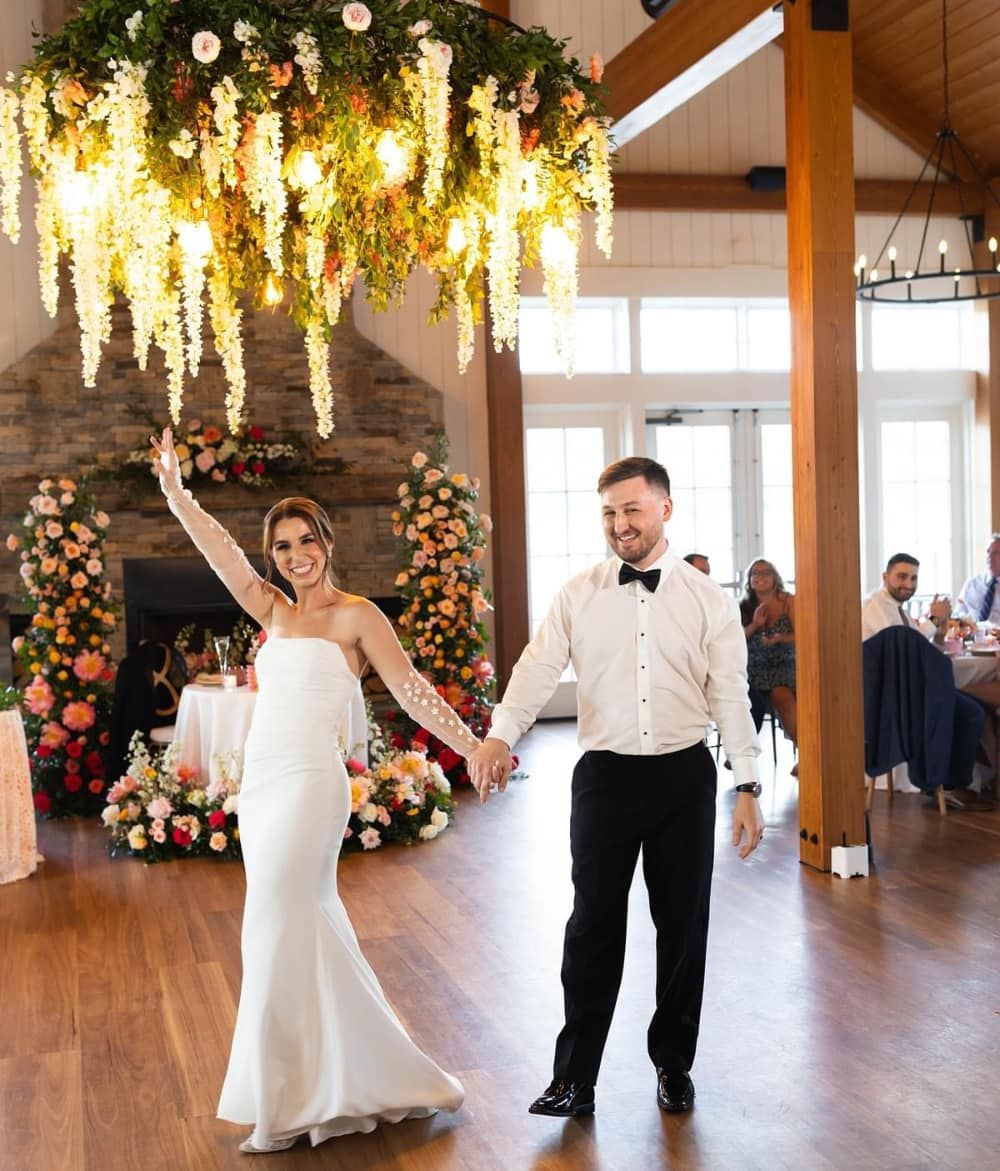 Wedding couple dance under lighting